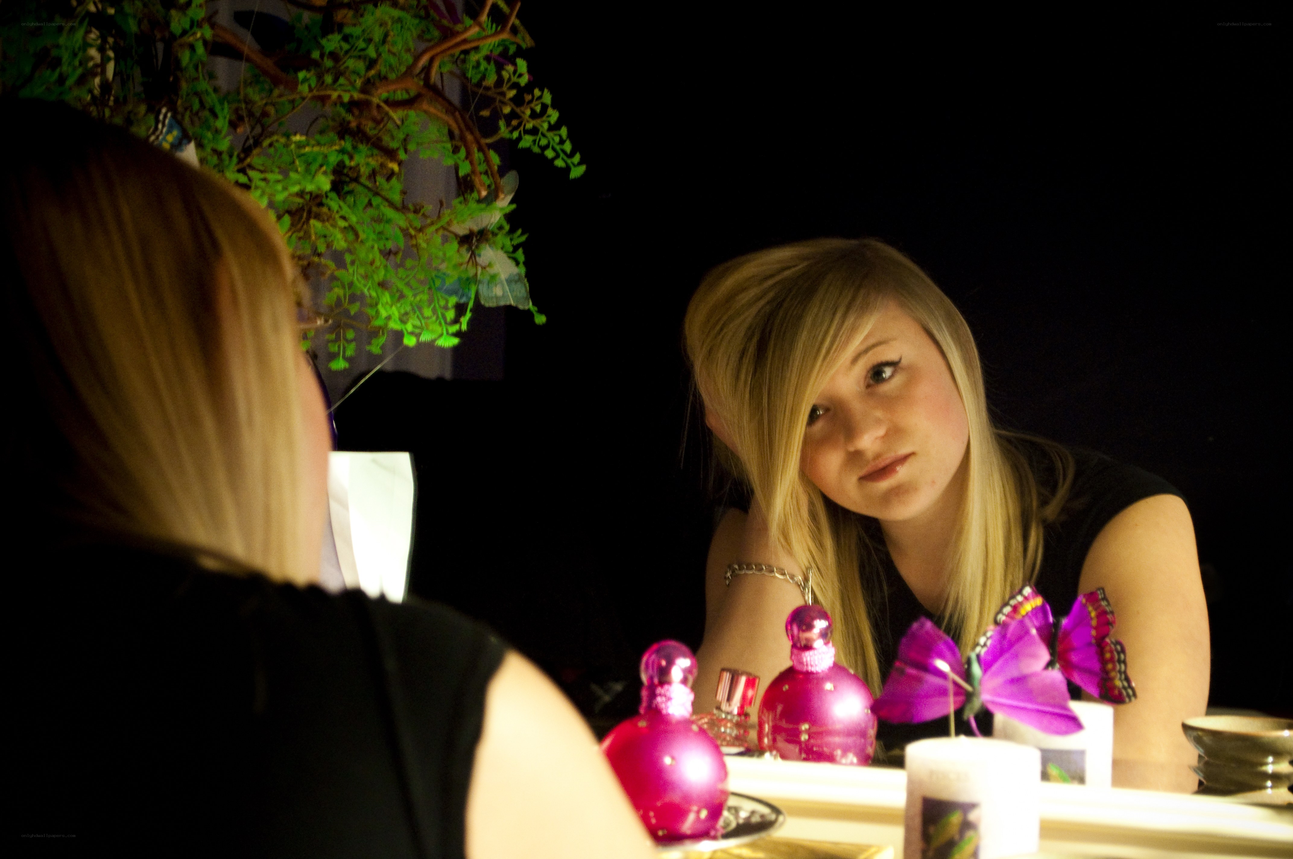 woman looking in mirror