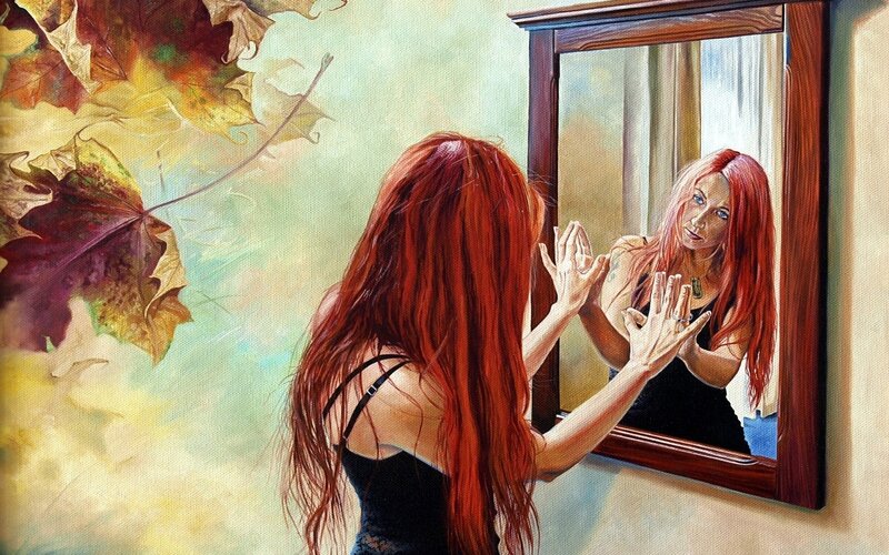 Woman looking in mirror