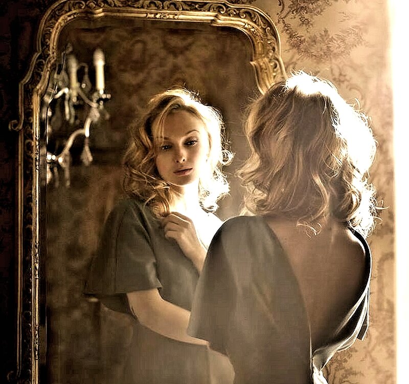 Woman Looking in Mirror — Brown, Dramatic, Photograph, Candle Sconce
