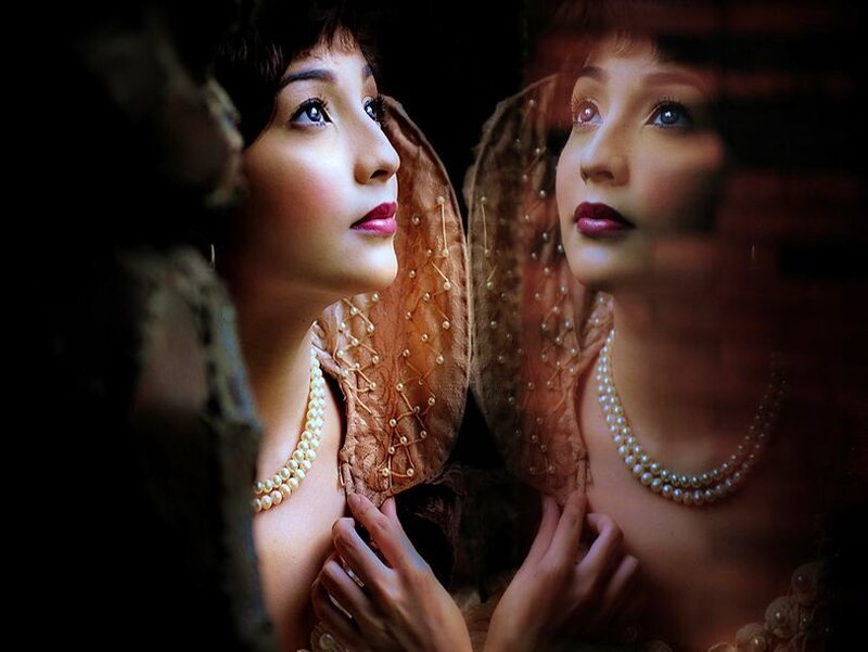 Woman Looking in Mirror — Brown
