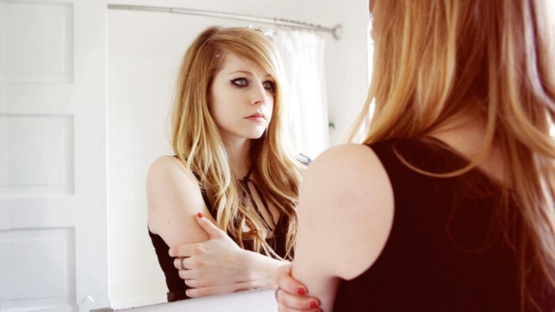 Woman Looking in Mirror — White, Contemplative, Photograph, Black Top