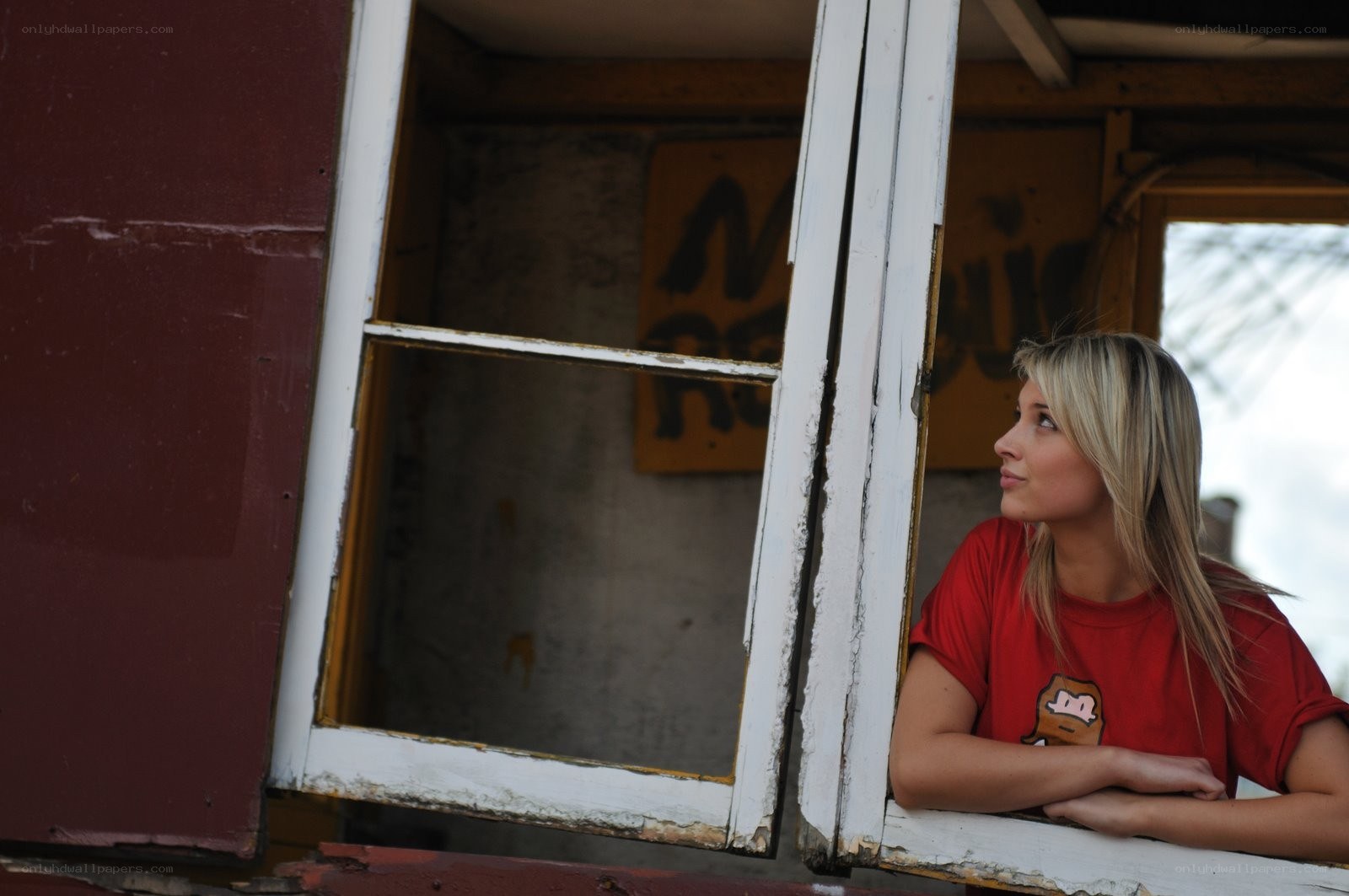 woman looking out a window