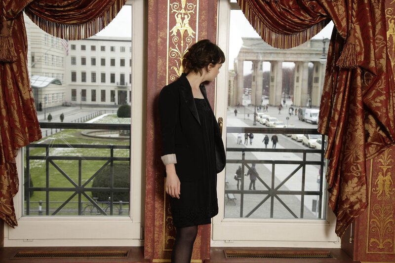 Woman looking out at Brandenburg Gate
