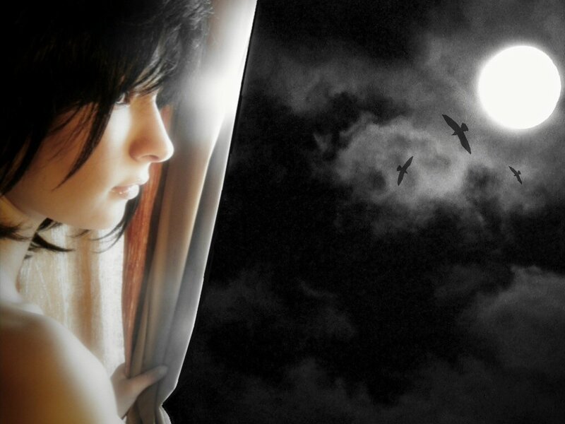 woman looking out at moon