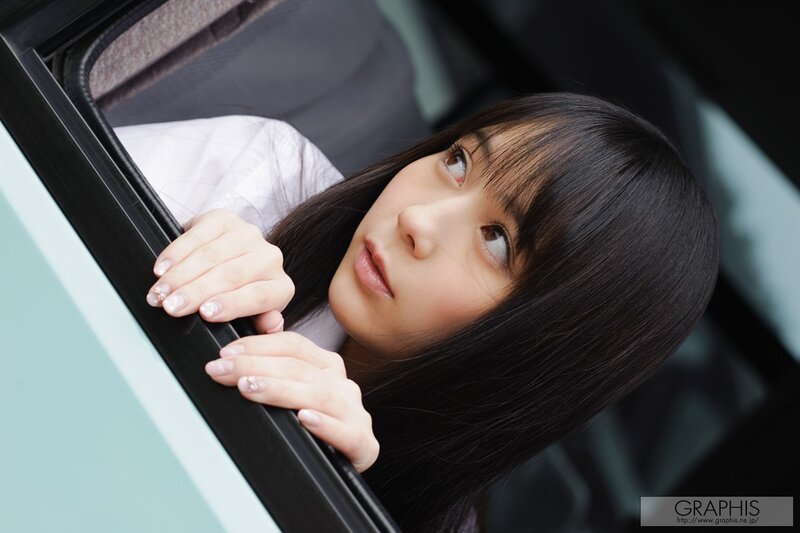 woman looking out car window