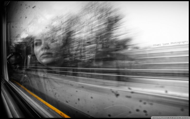 Woman Looking Out Train Window — Black, Dramatic