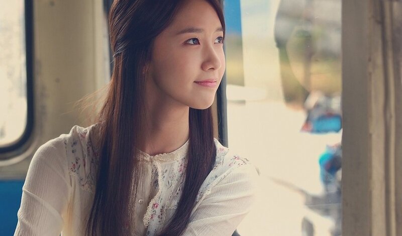 woman looking out train window
