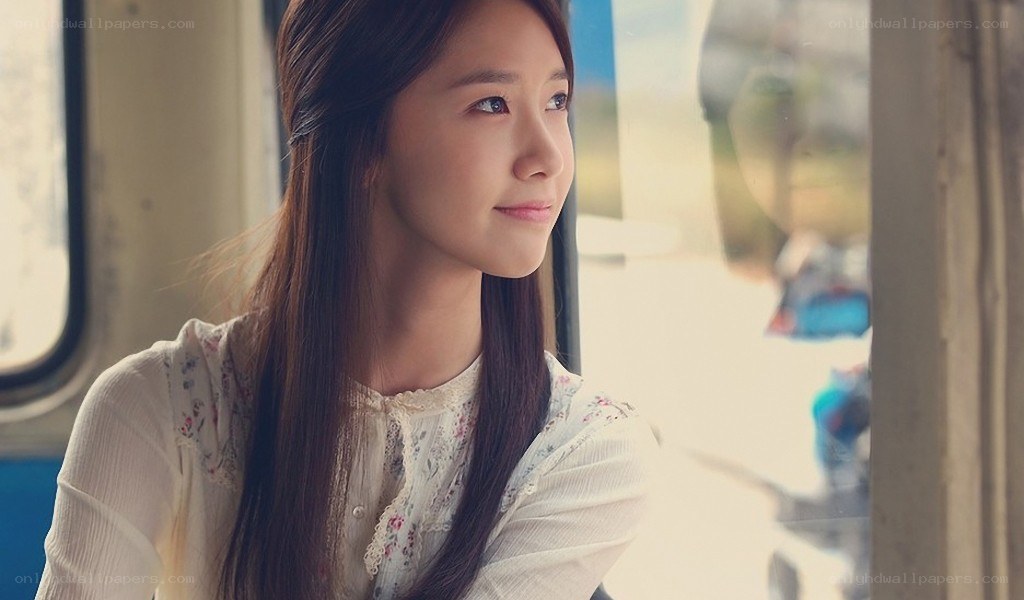 woman looking out train window