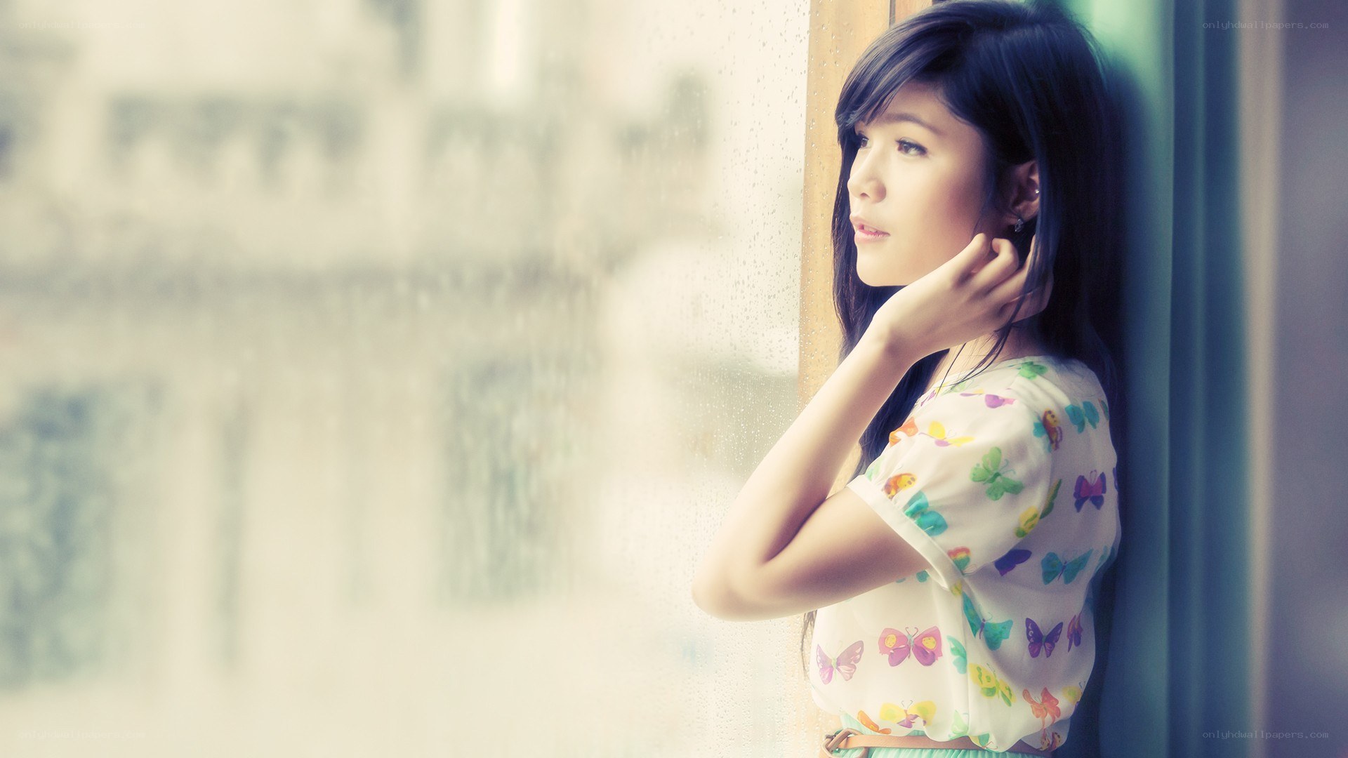 woman looking out window