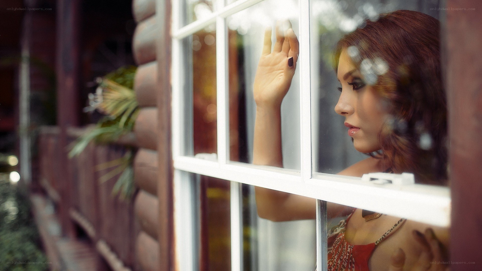 woman looking out window