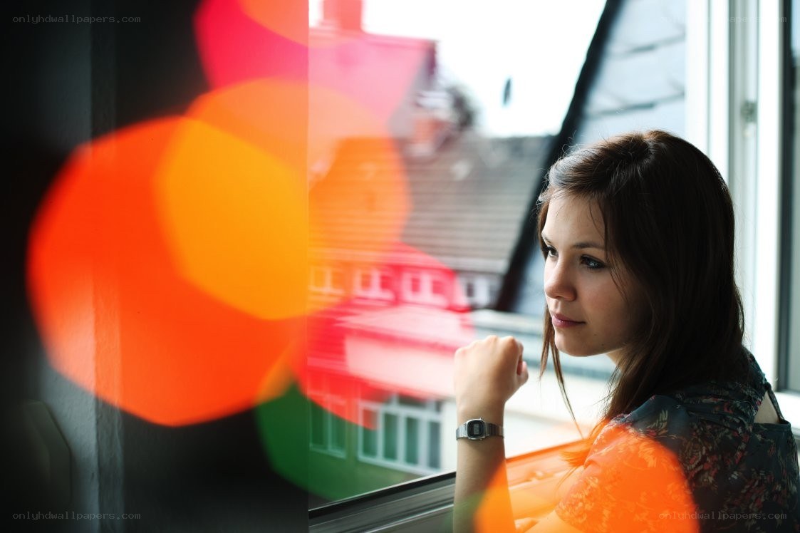 woman looking out window
