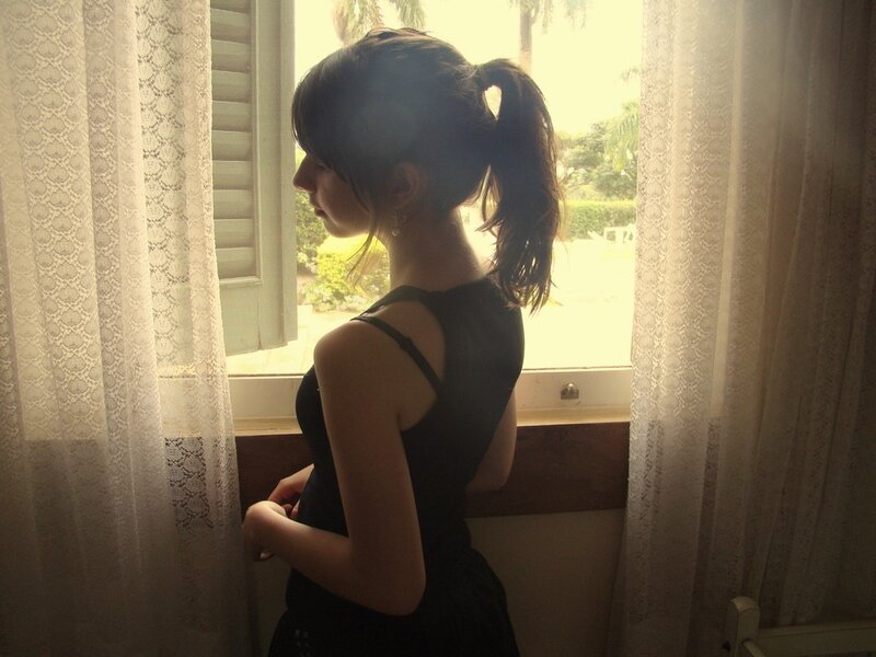 woman looking out window