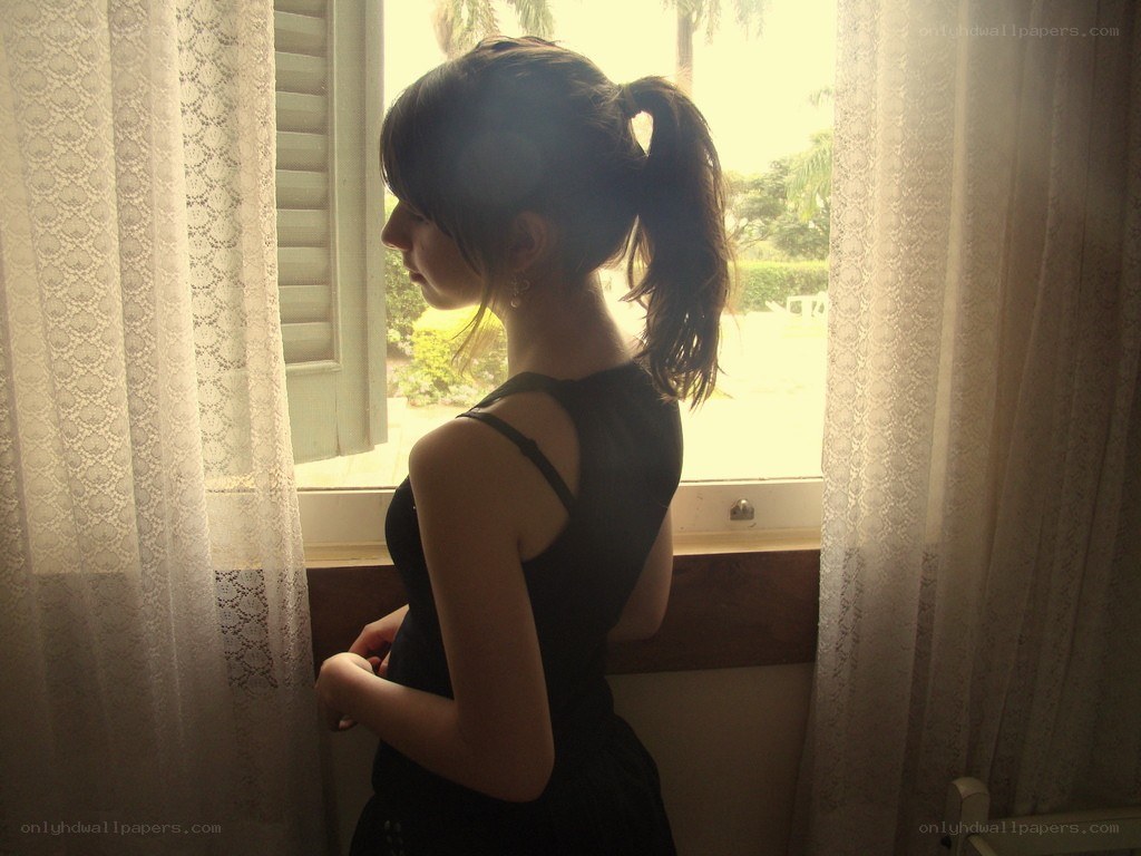 woman looking out window