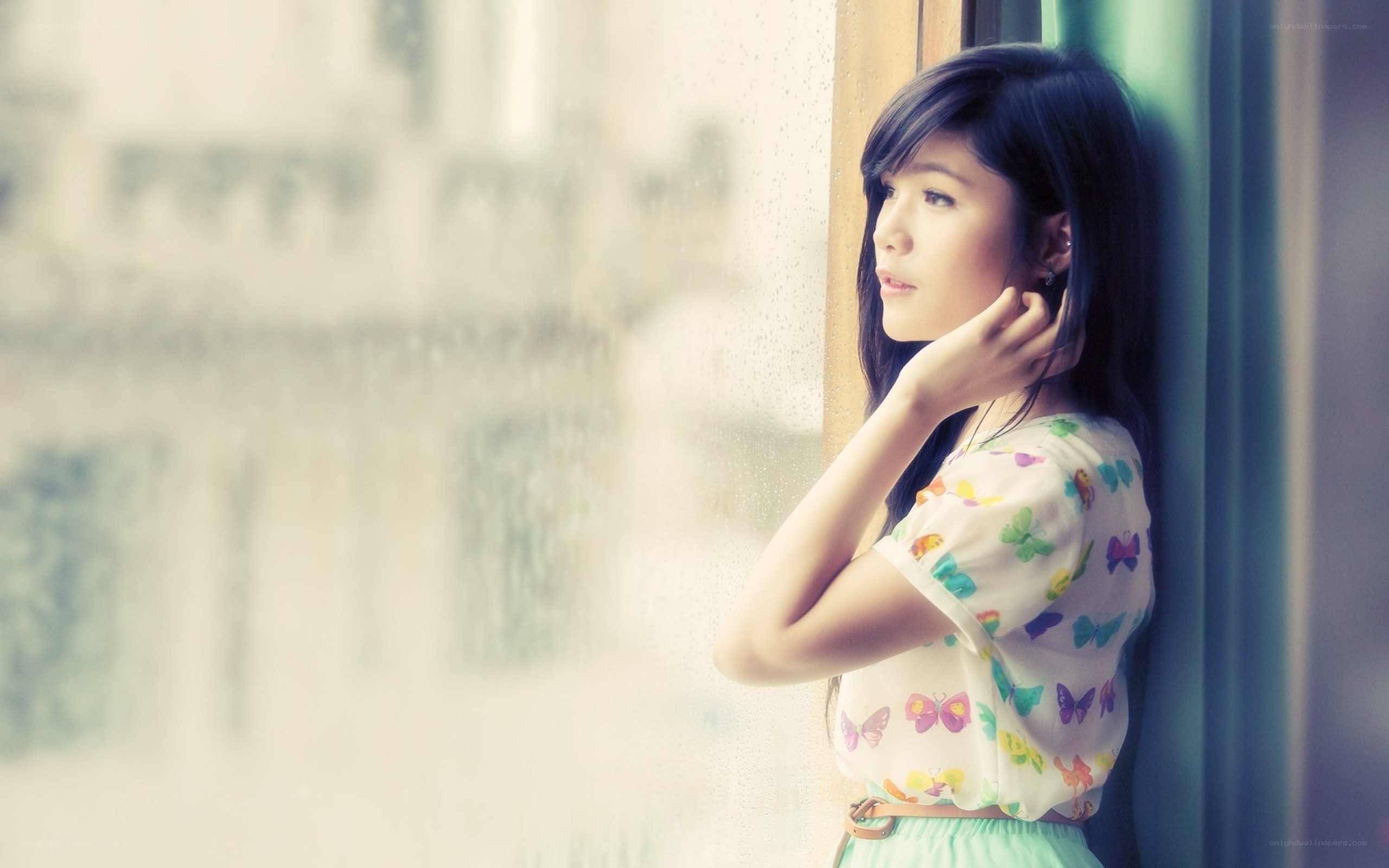 woman looking out window