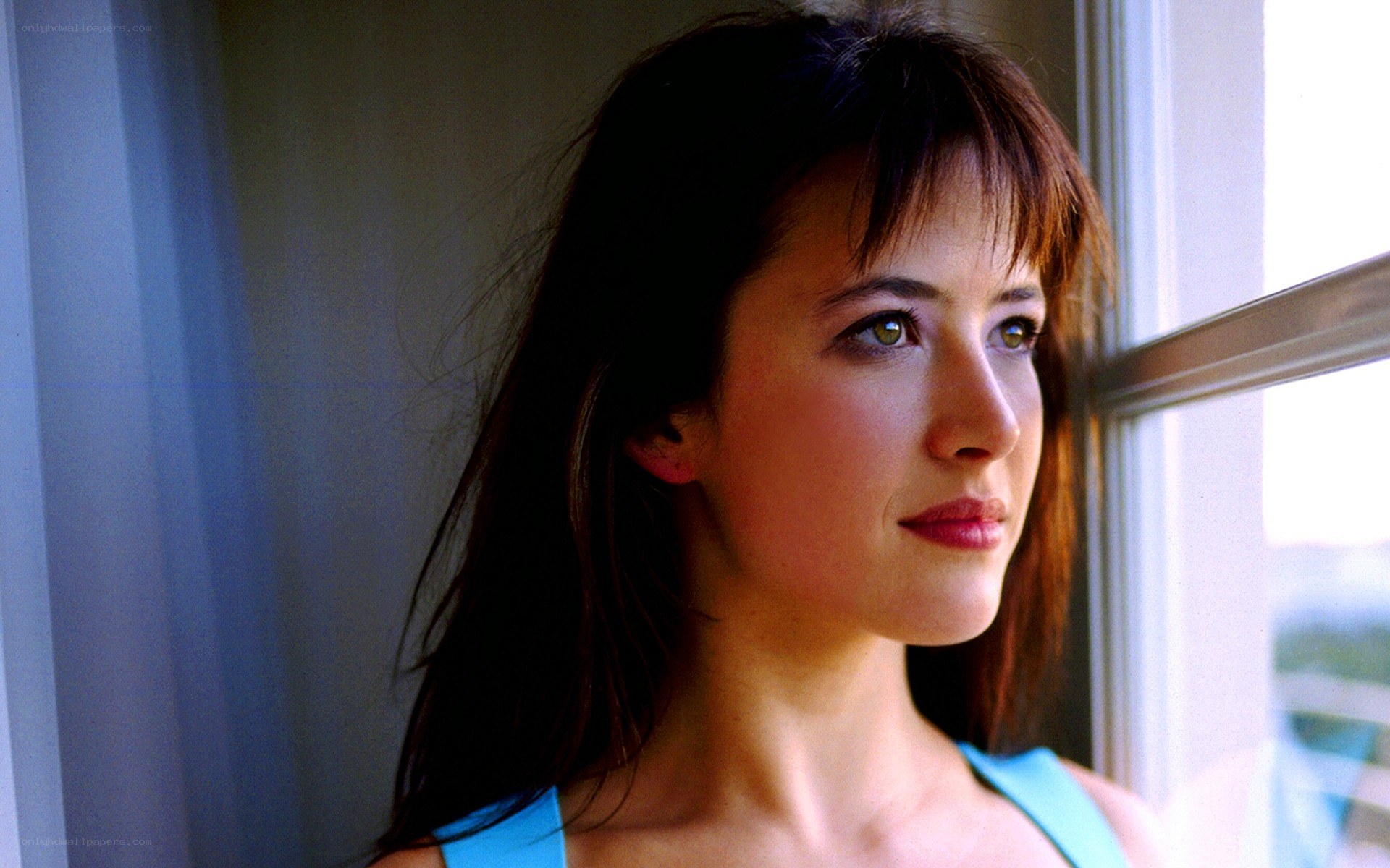 woman looking out window