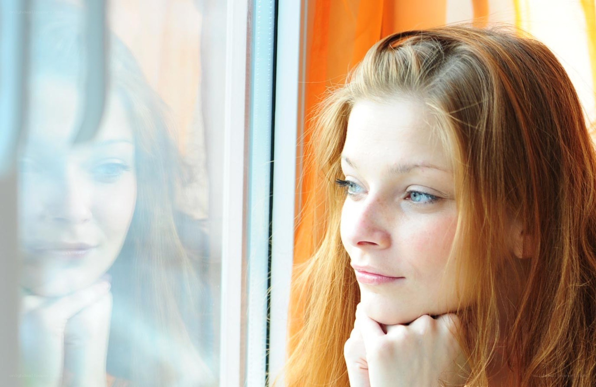 woman looking out window