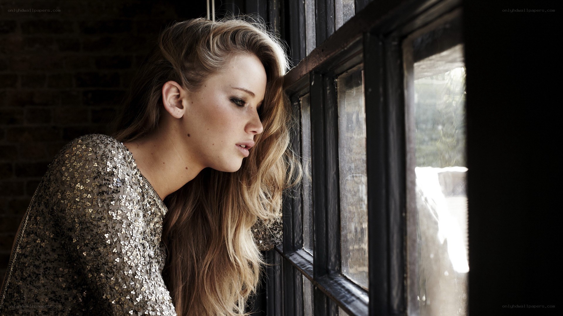 woman looking out window