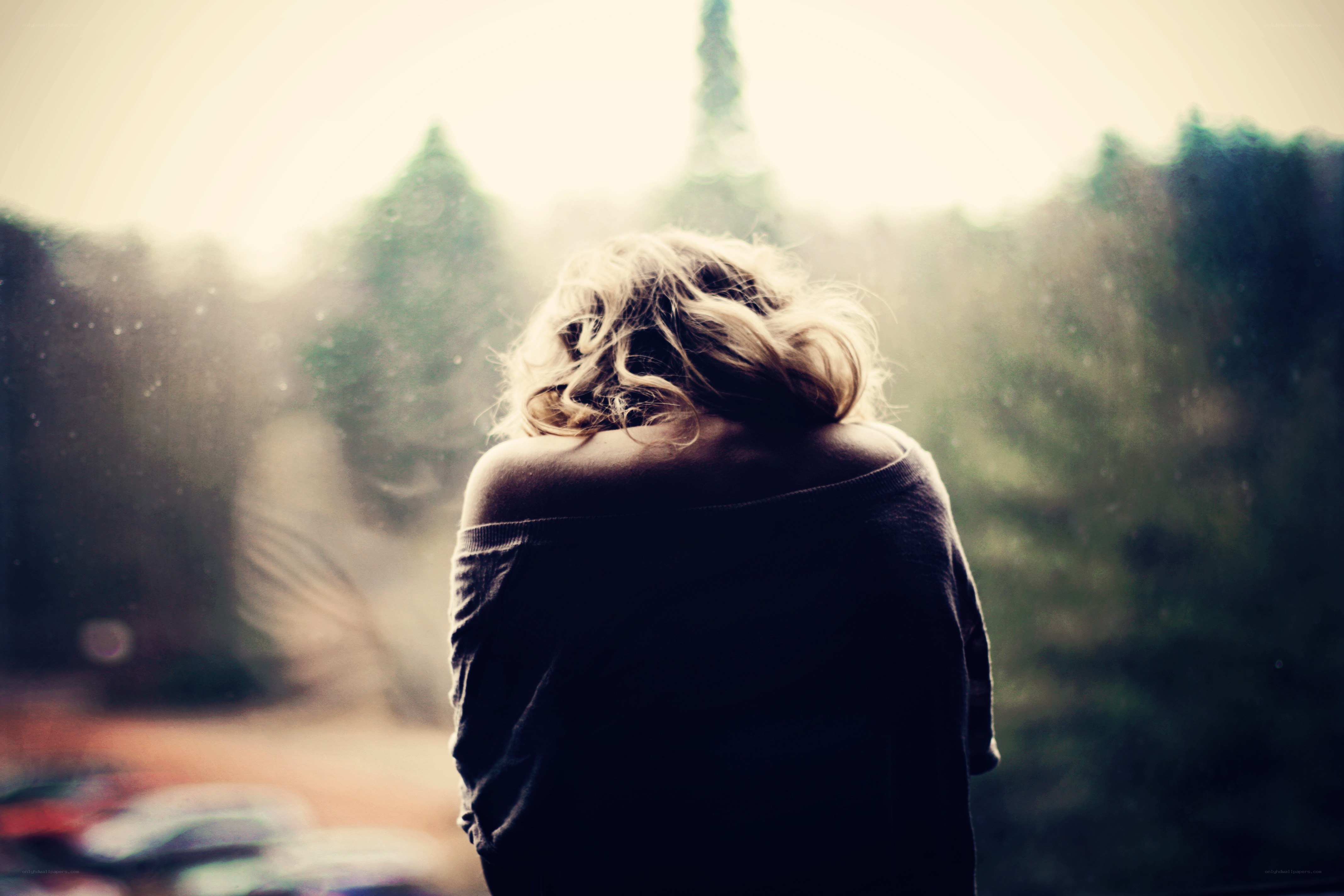 woman looking out window