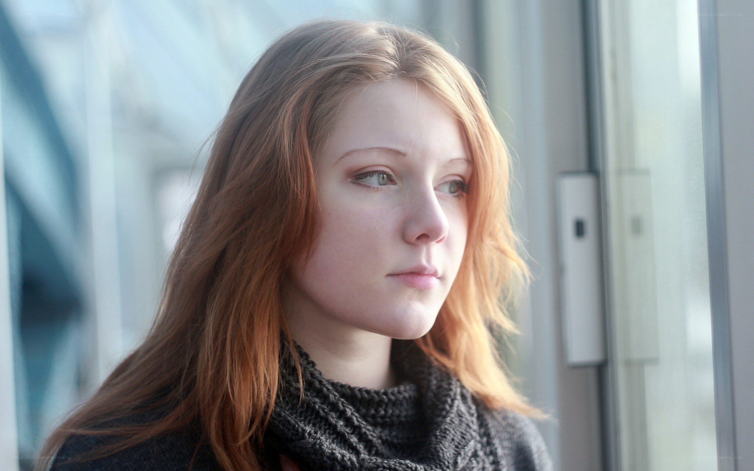 woman looking out window