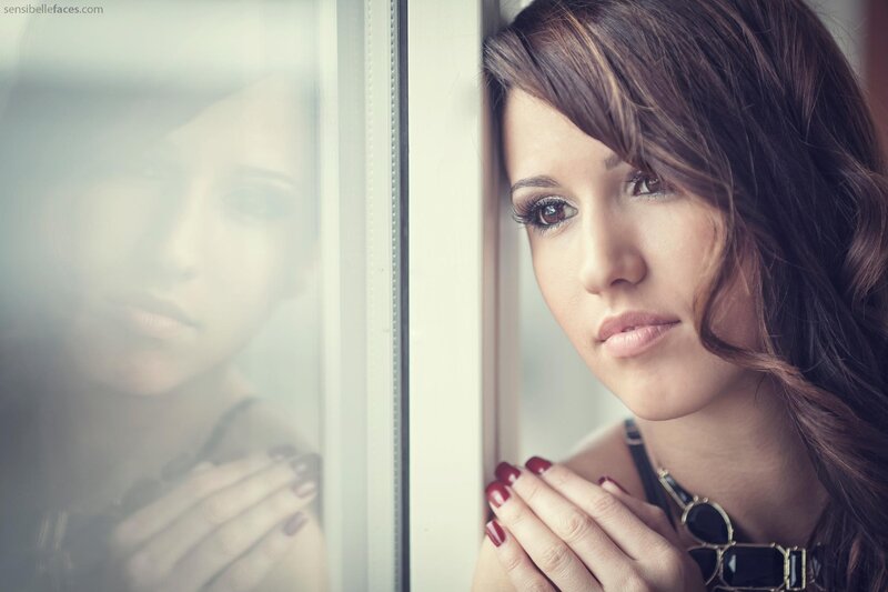 woman looking out window