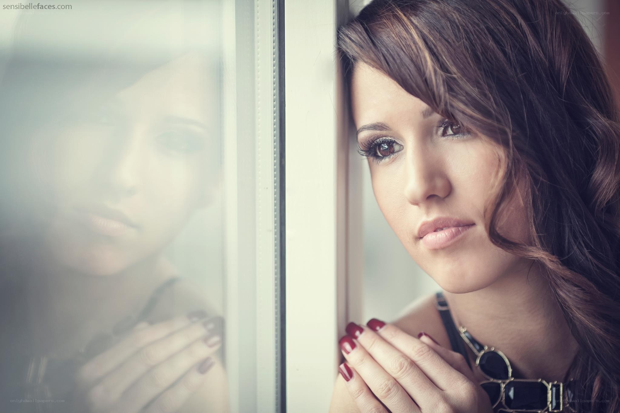 woman looking out window