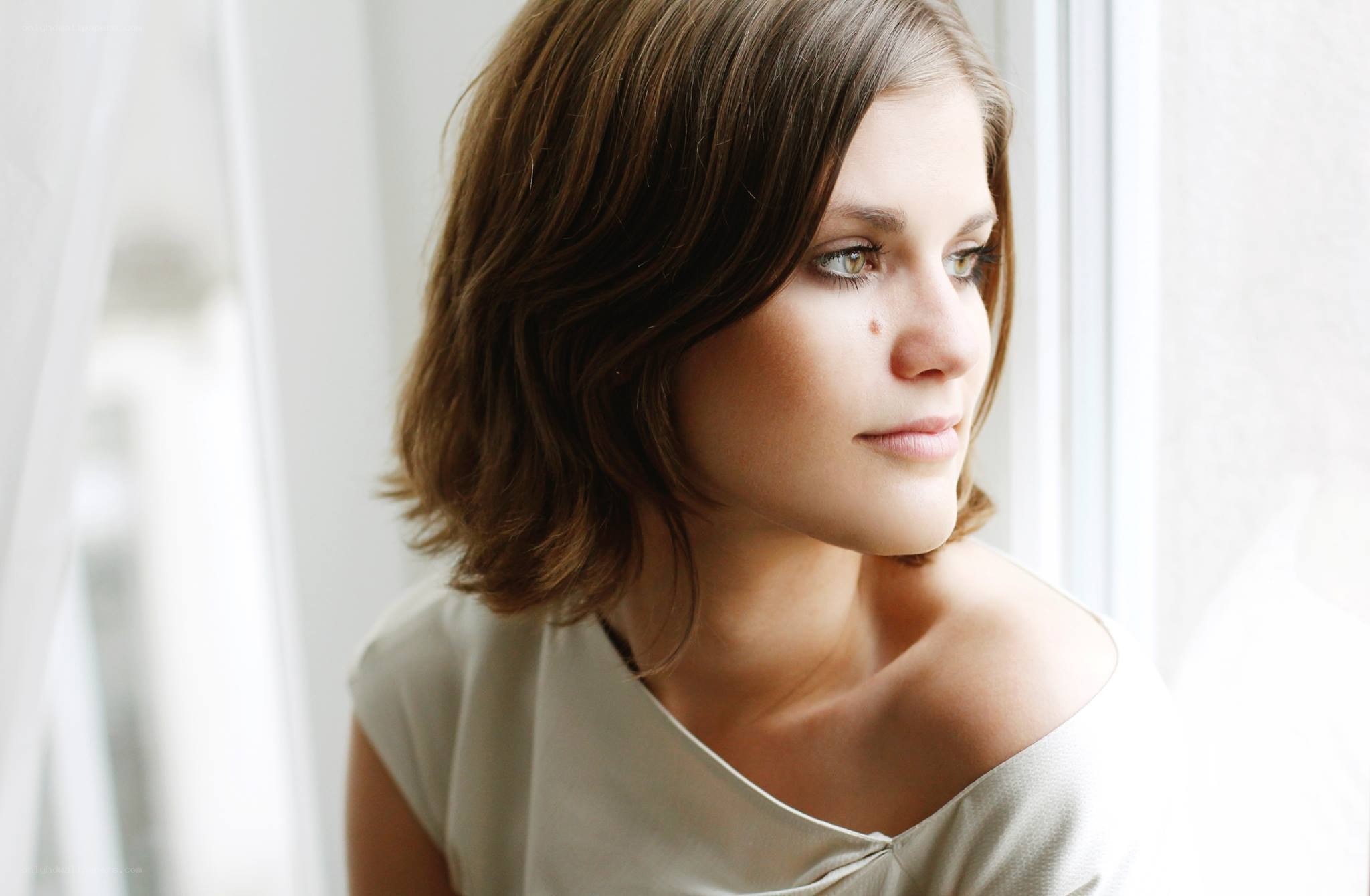 woman looking out window