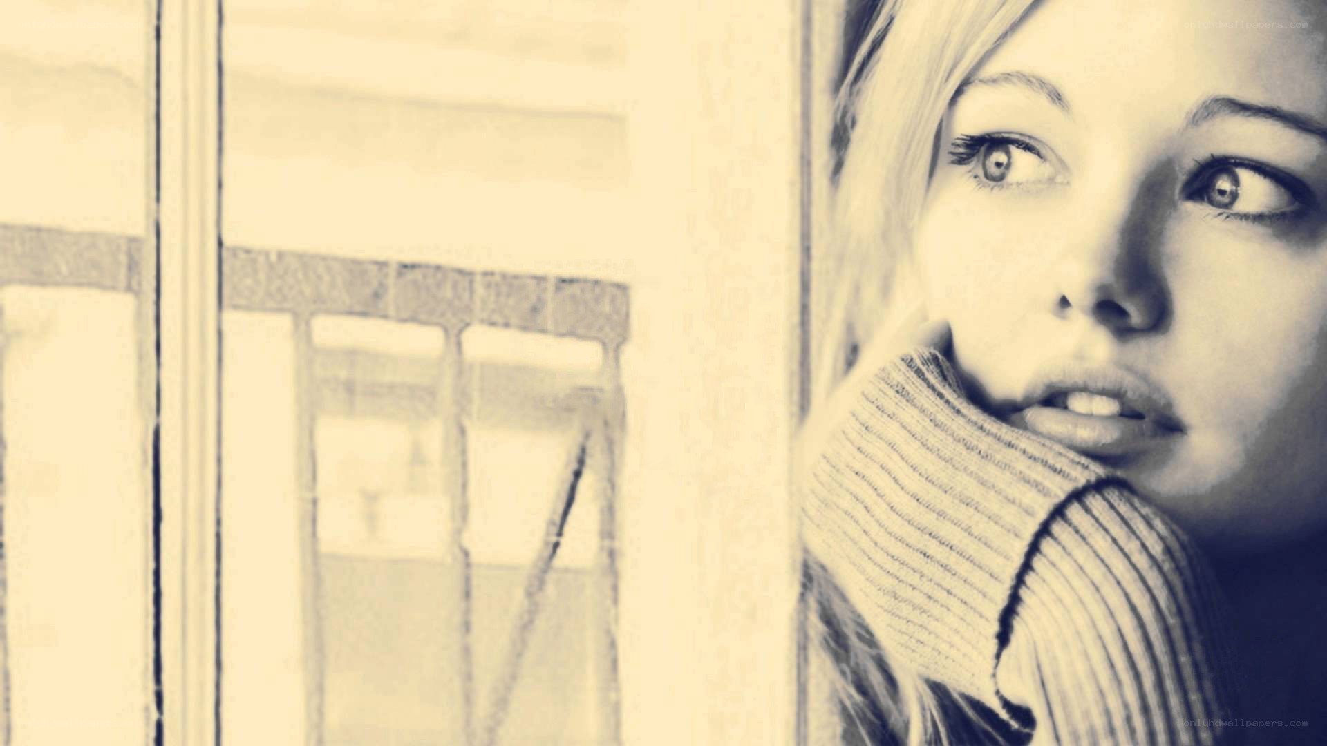 woman looking out window
