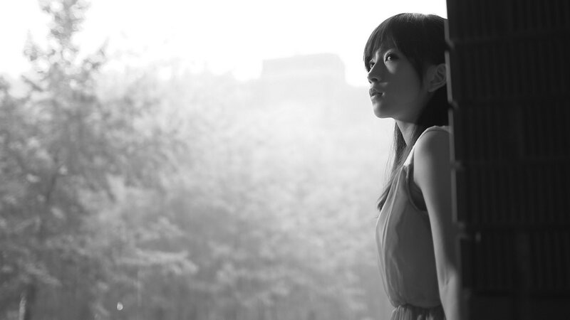 woman looking out window