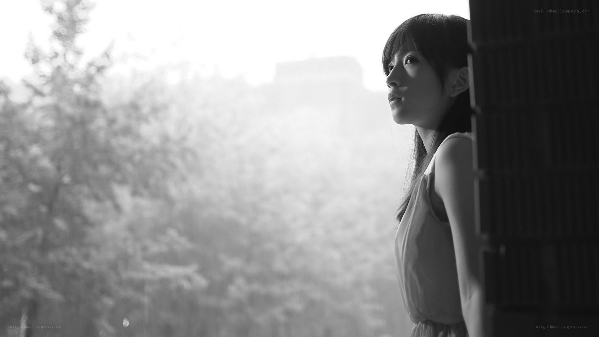 woman looking out window