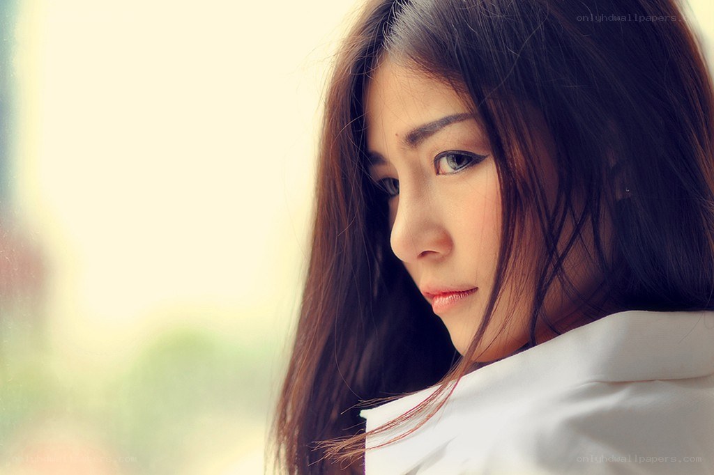 woman looking out window