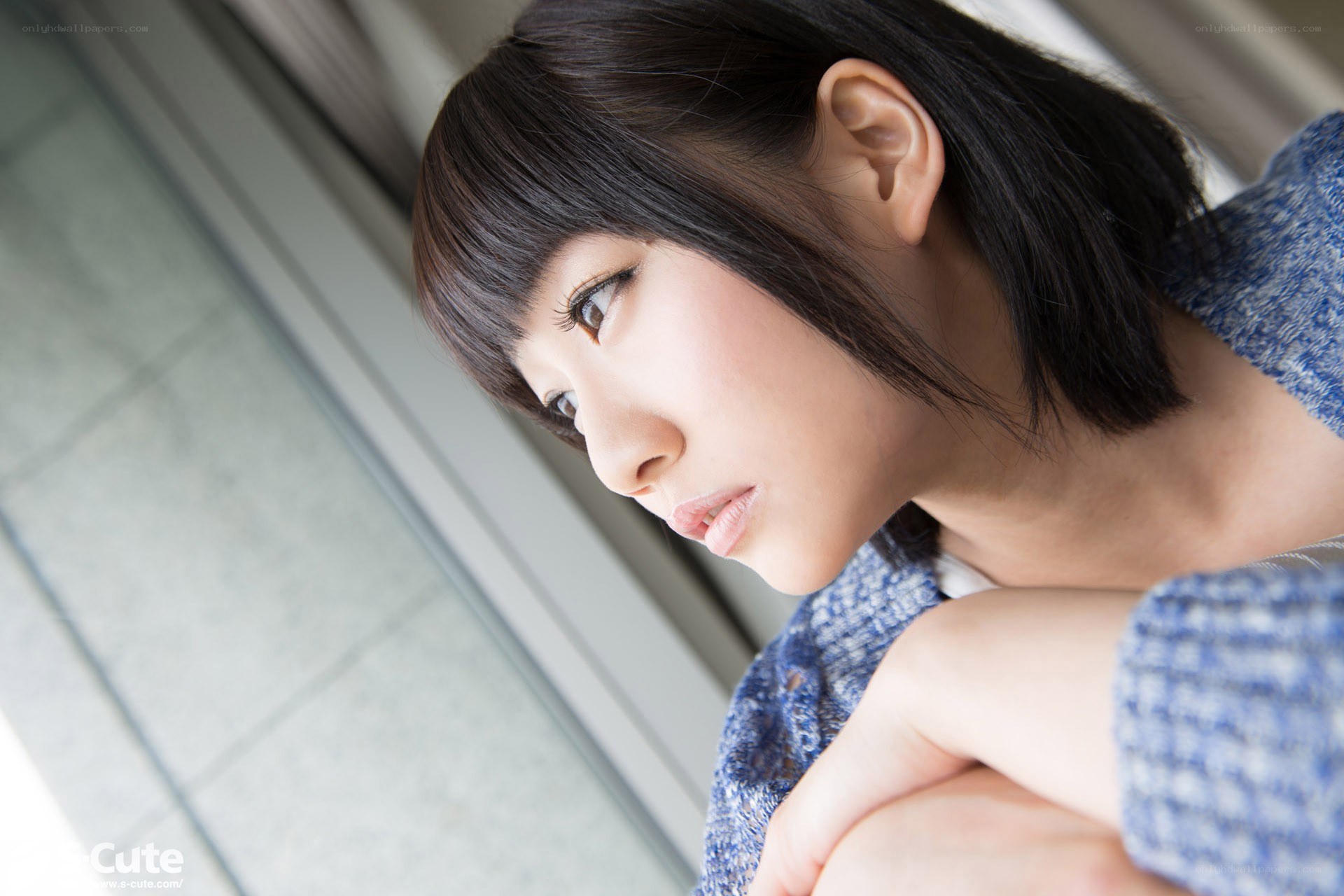 woman looking out window