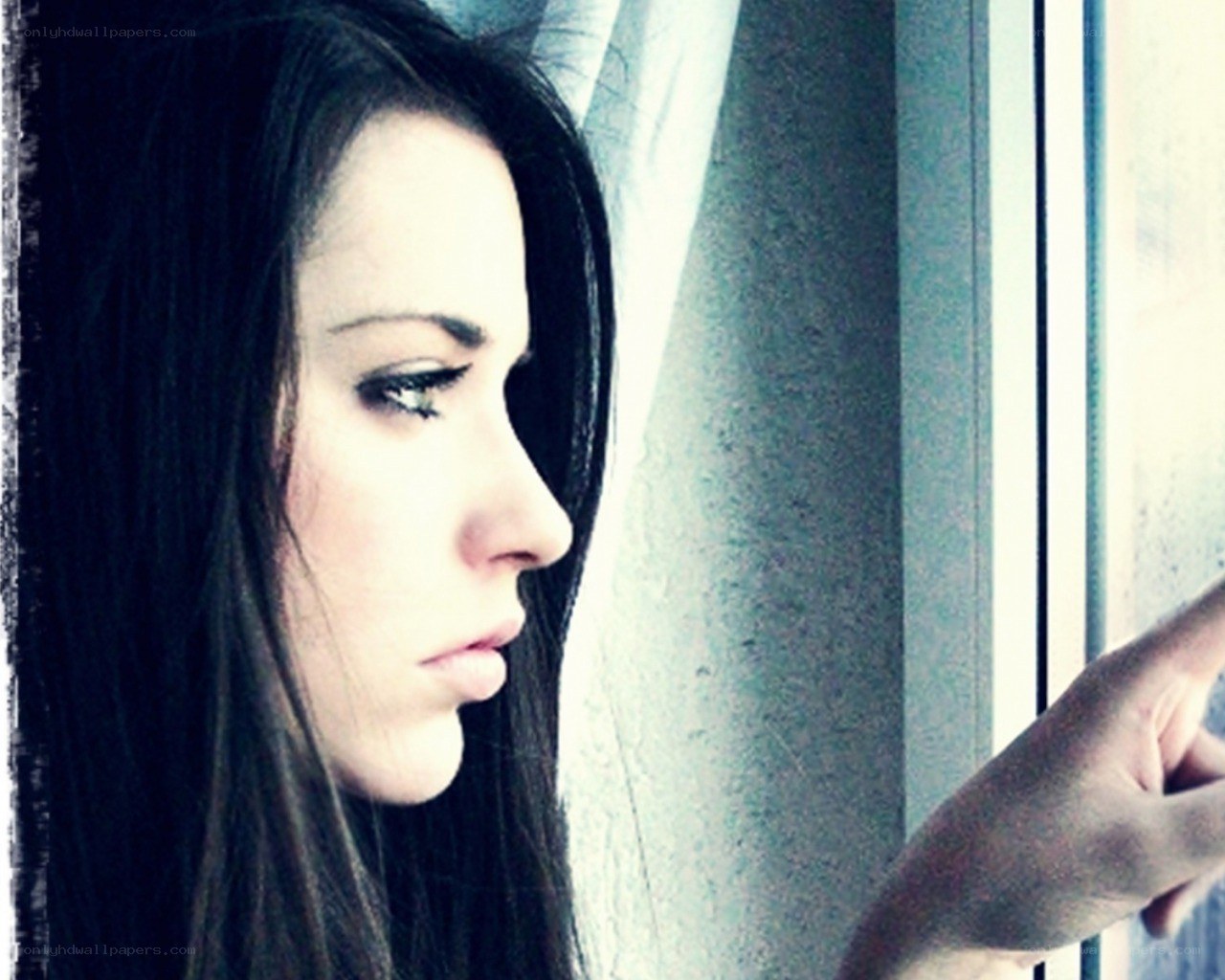 woman looking out window