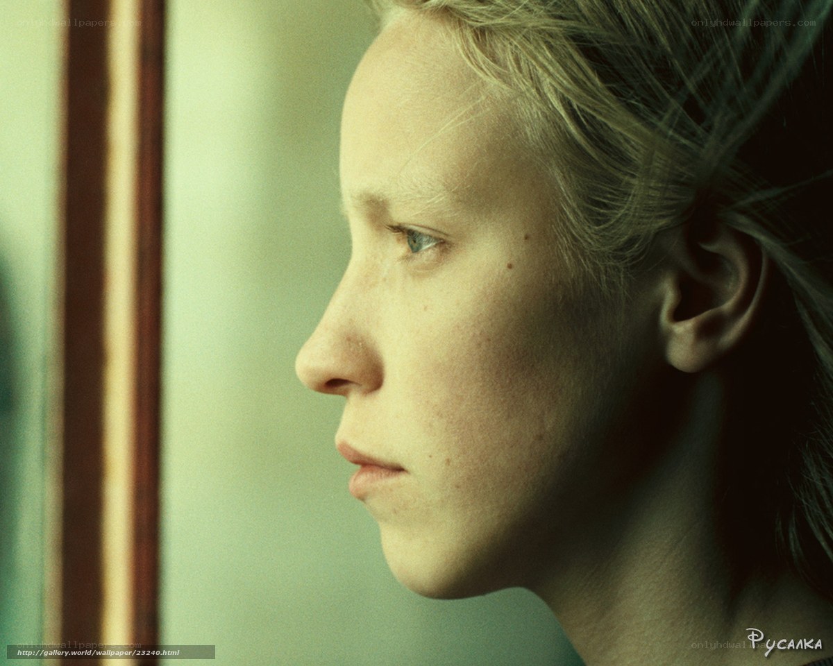 woman looking out window