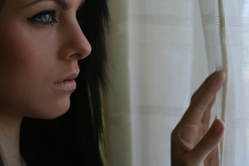 woman looking out window