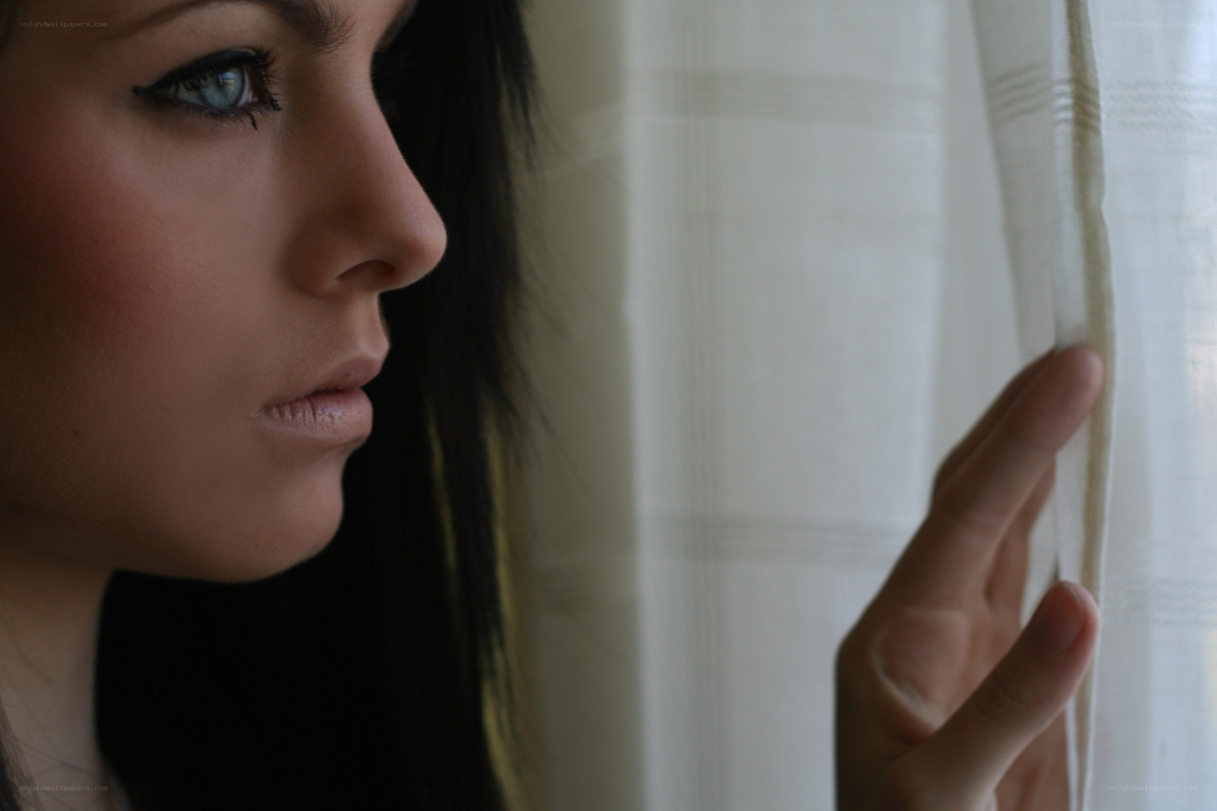 woman looking out window