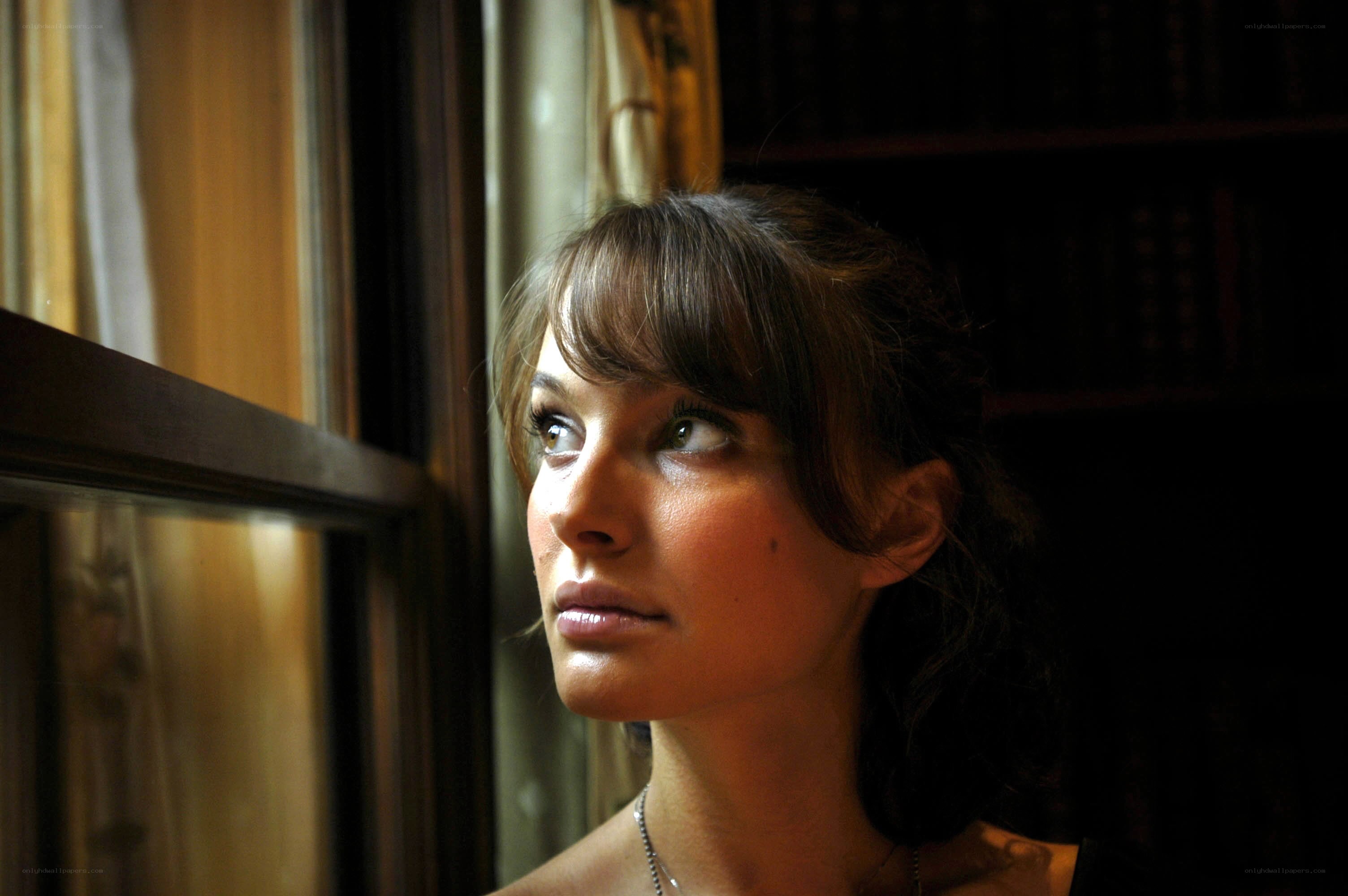 woman looking out window