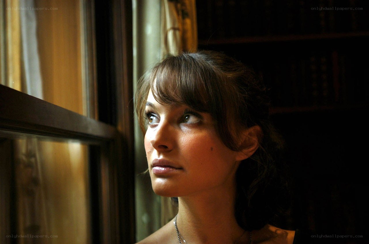 woman looking out window