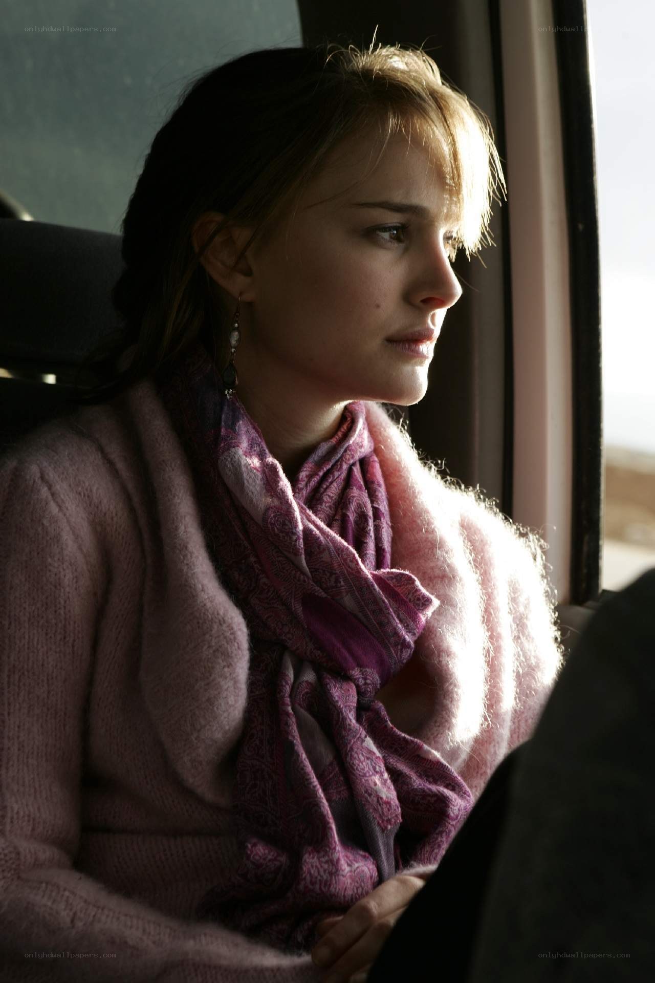 woman looking out window