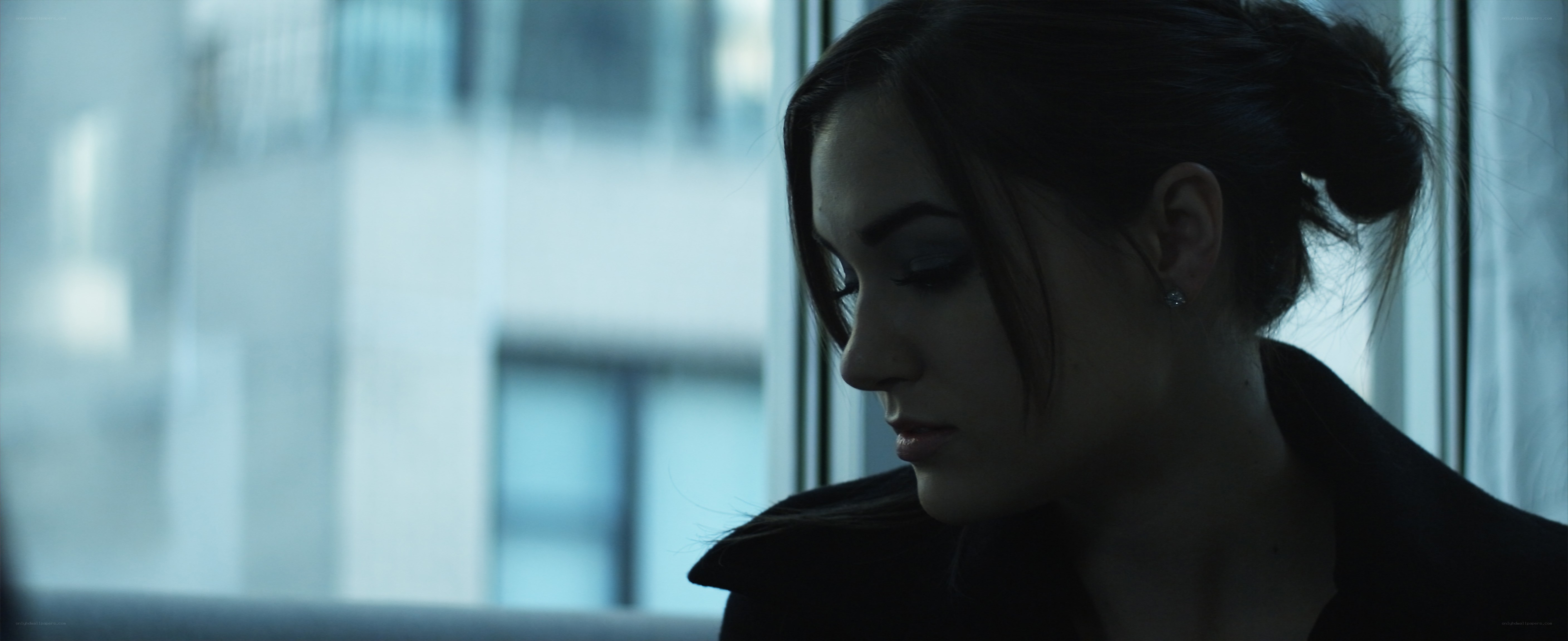 woman looking out window