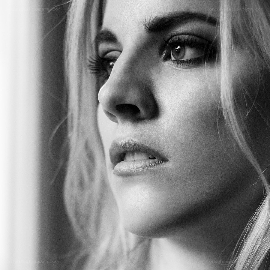 woman looking out window