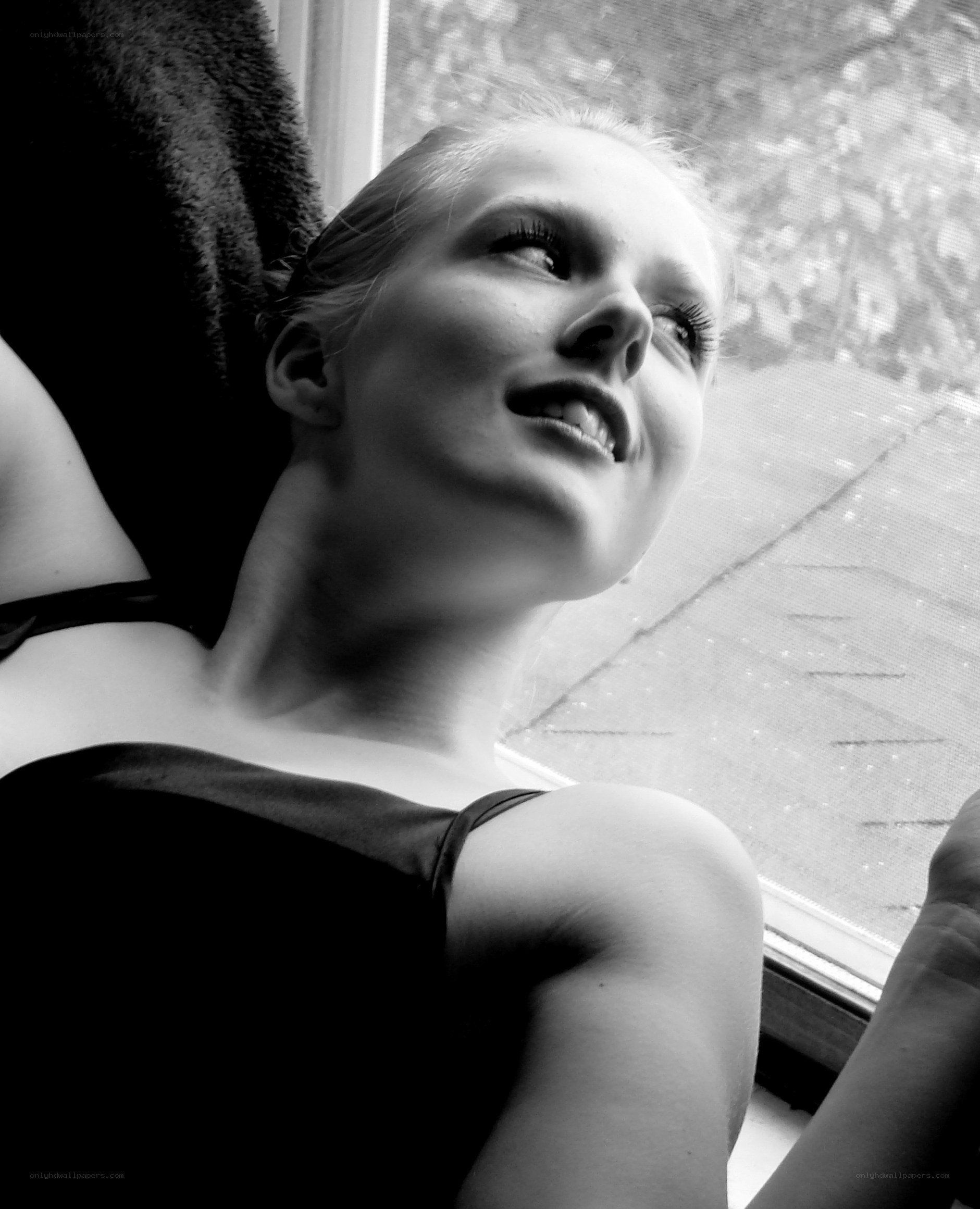 woman looking out window