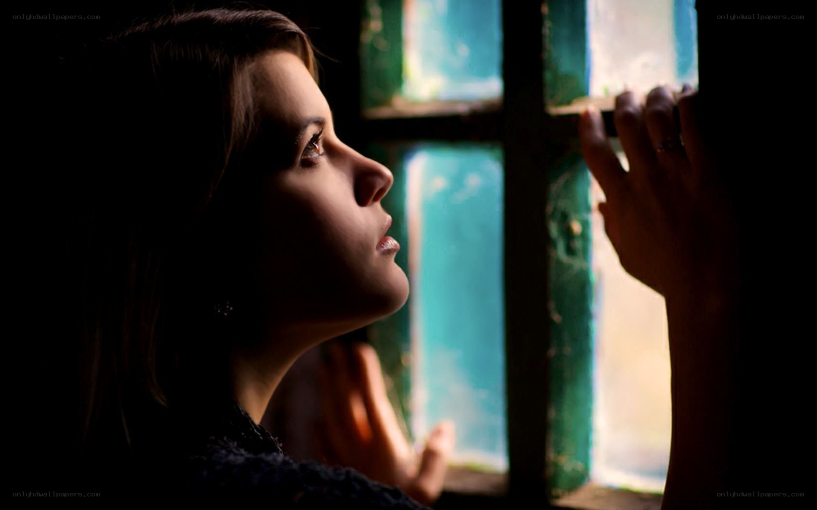 woman looking out window