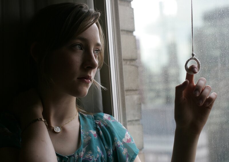 woman looking out window