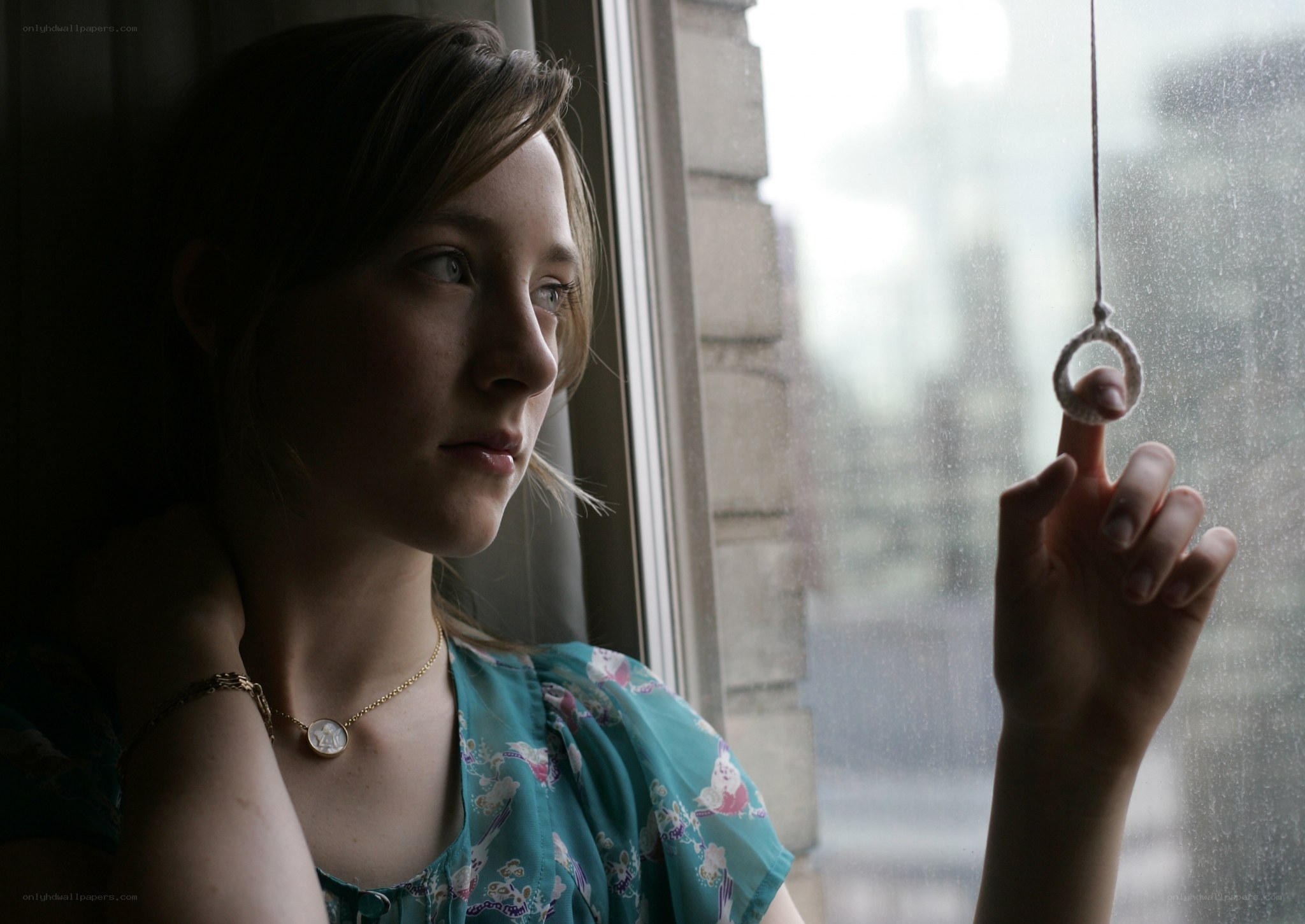 woman looking out window