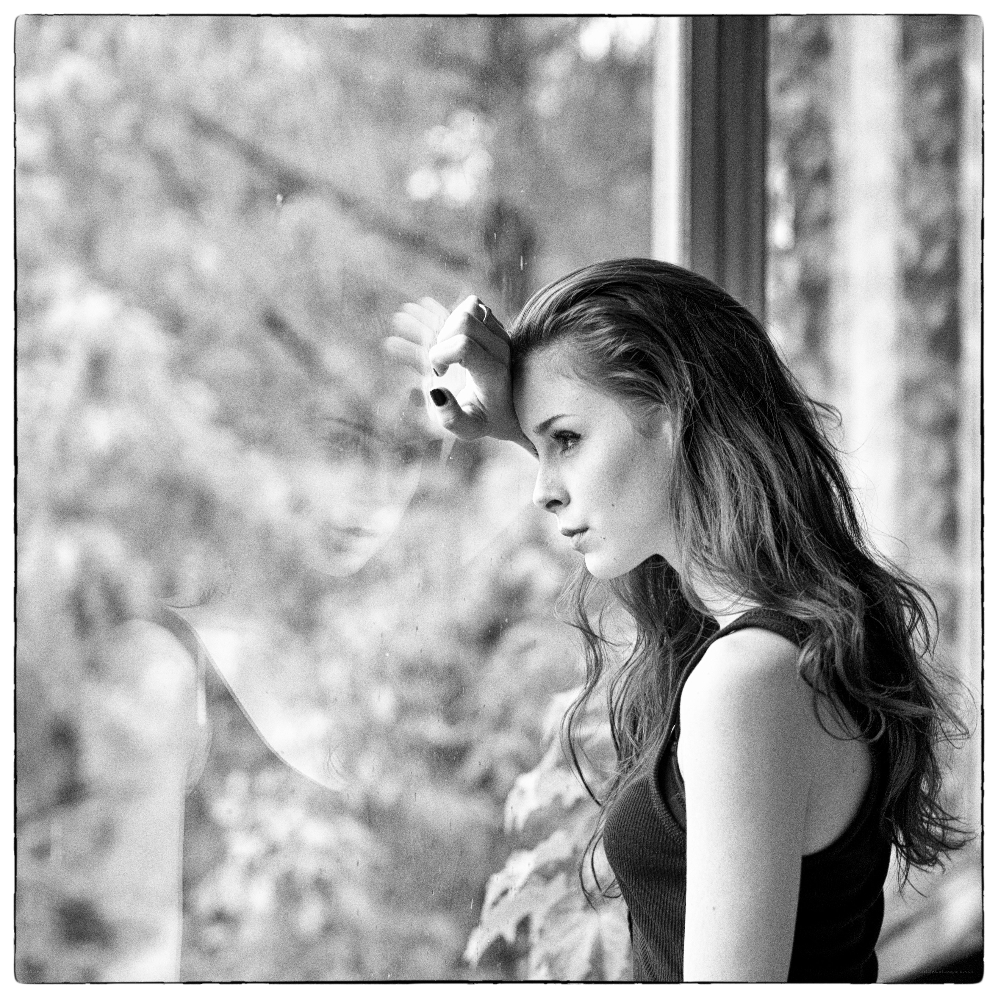woman looking out window