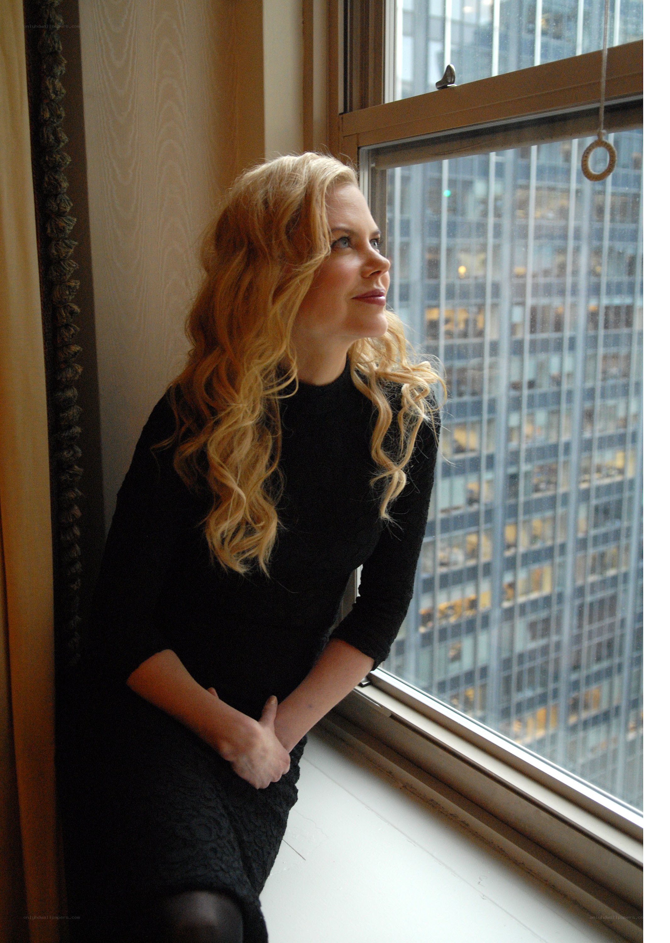 woman looking out window