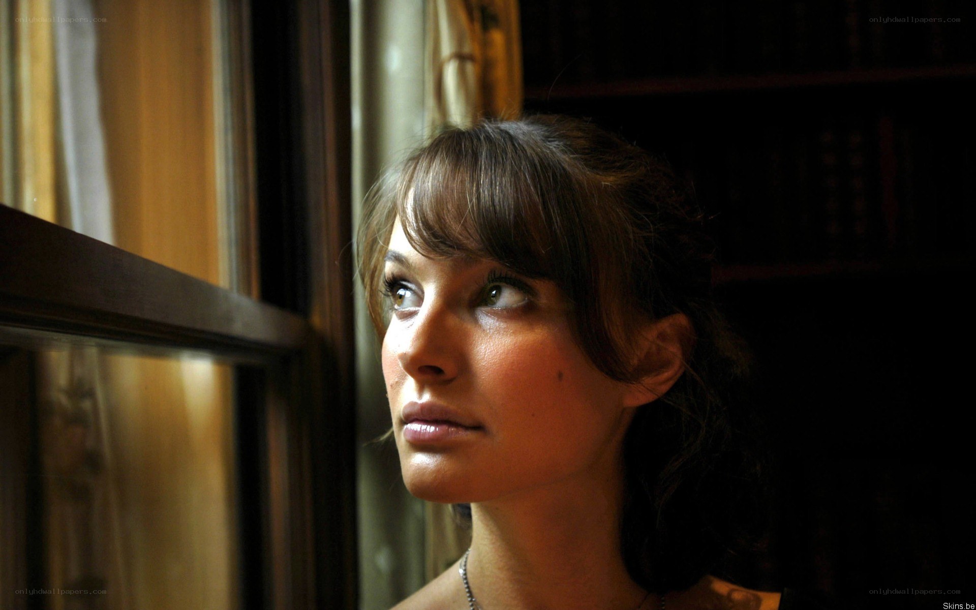 woman looking out window