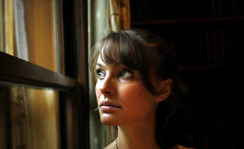 woman looking out window