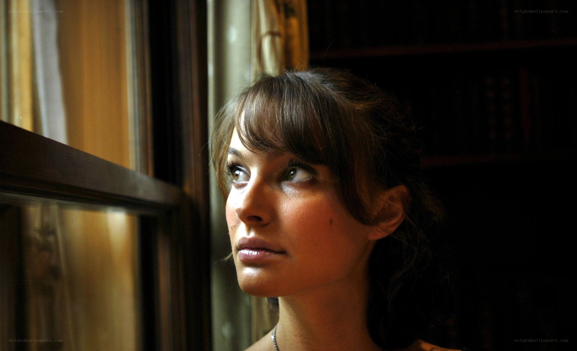 woman looking out window