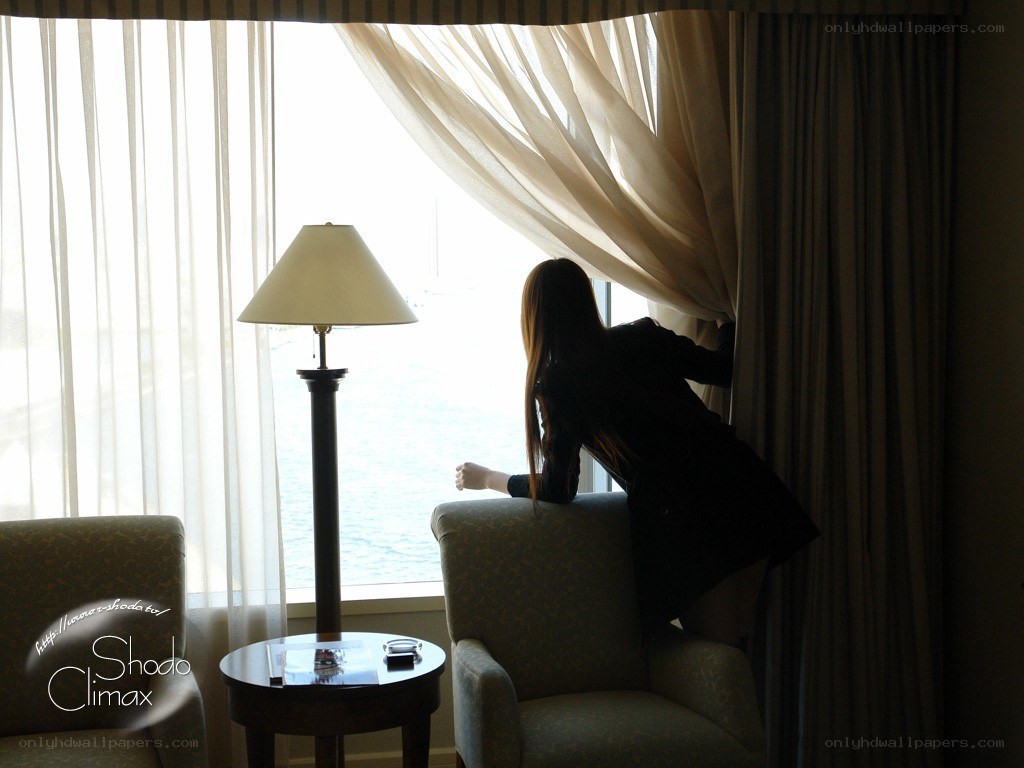 woman looking out window